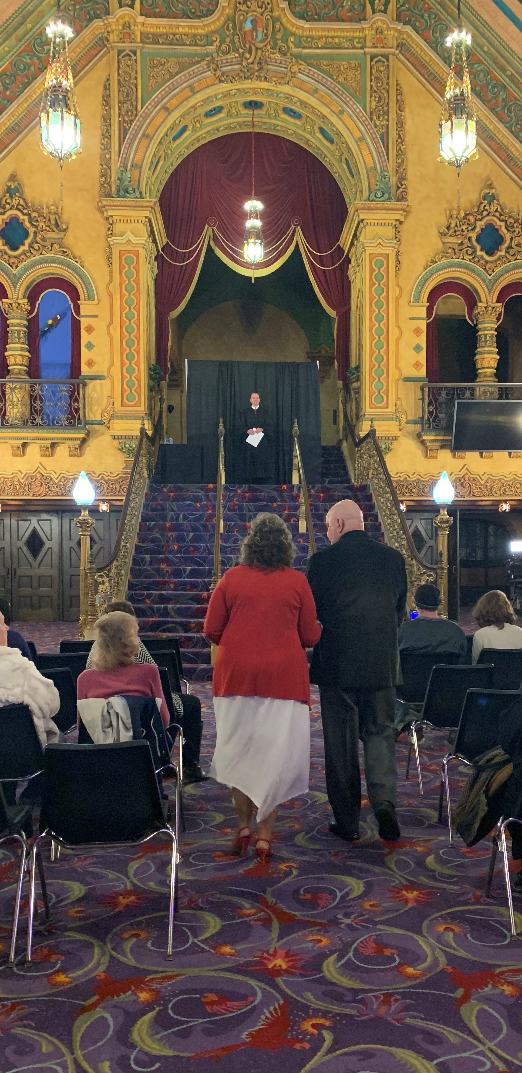 A couple walks down the aisle at the Akron Civic Theatre on Valentine's Day 2019